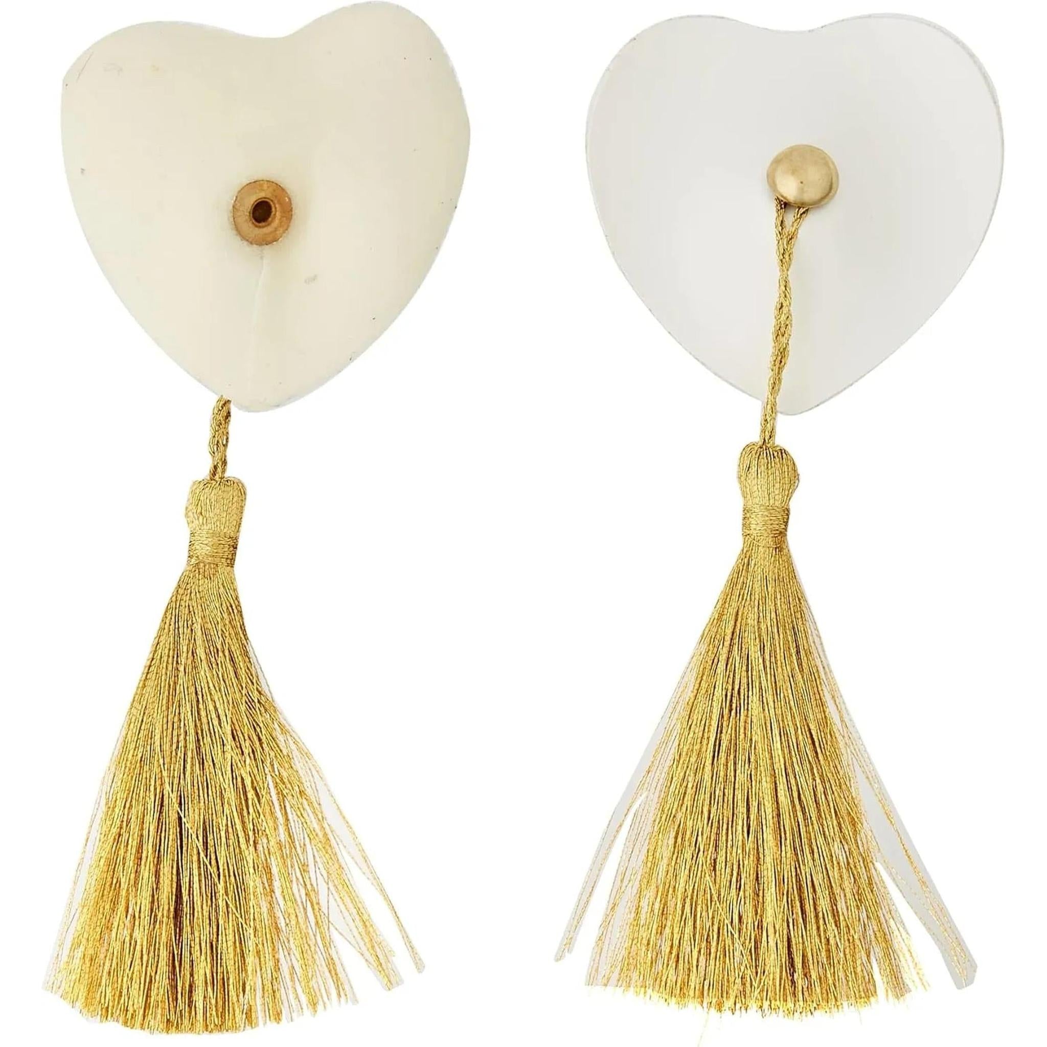 Copricapezzoli bianchi con nappe dorate