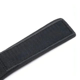 Polsiera nera in tessuto morbido con chiusura a velcro