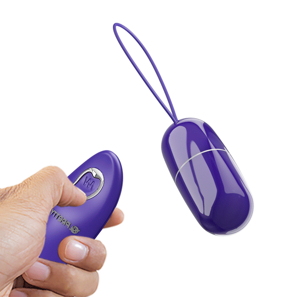 Ovulo vibrante wireless viola acceso con cinghia e telecomando a pulsante ondulato