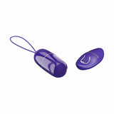 Ovulo vibrante wireless viola acceso con linea divisoria bianca e telecomando