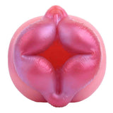 Toy vibrante sferico in silicone rosa viola con labbra stilizzate e texture