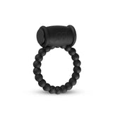 Anello vibrante nero con perline sferiche e simbolo stilizzato inciso