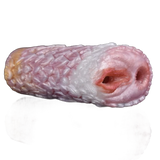 Vista frontale dildo Camellia con finitura a petali sovrapposti e doppie aperture carnose