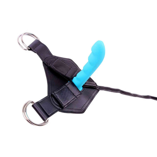 Dettaglio testina ondulata vibratore azzurro su supporto harness nero