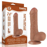 Dildo marrone chiaro accanto confezione Lovetoy sliding skin layer