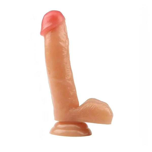 Dildo realistico rosa carne con ventosa e testicoli, vista laterale