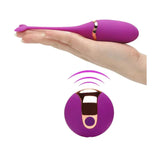 Ovetto vibrante viola Dolphin Egg tenuto in mano con telecomando wireless
