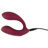 Vibratore flessibile colore bordeaux in carica con cavo nero