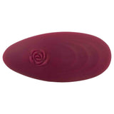 Telecomando vibratore colore bordeaux con incisione rosa stilizzata