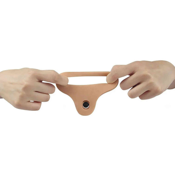 Doppio dildo rosa carne flessibile mostrato da due mani con pulsante nero