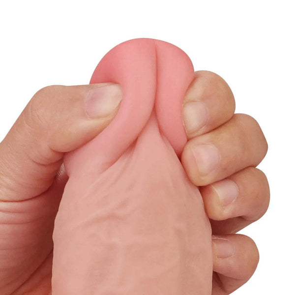 Primo piano testa dildo rosa carne morbida con fessura centrale