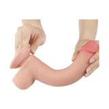 Dildo rosa carne morbido pieghevole con texture scroto e punta colorata