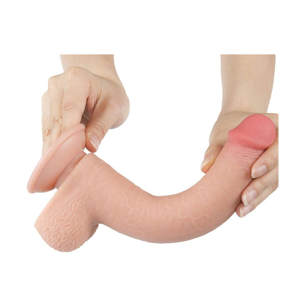Dildo rosa carne morbido pieghevole con texture scroto e punta colorata