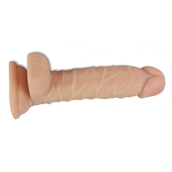 Dildo realistico rosa carne con base a ventosa e dettagli anatomici venati