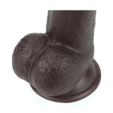 Vista ravvicinata testa scrotale rugosa e base circolare dildo nero