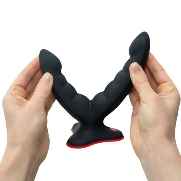 Dildo Fun Factory Ryde nero a doppia testa in silicone con texture ondulata e base ventosa rossa