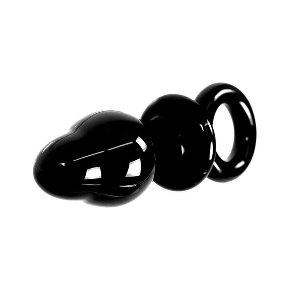 Vista laterale plug anale vetro nero con anello intermedio e superficie liscia