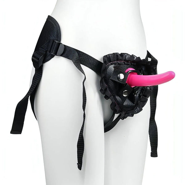 Supporto per dildo nero in pelle sintetica con cinturino e dildo rosa inserito