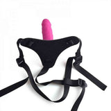 Strapon da uomo con pene rosa acceso e base nera in tessuto