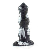 Dildo verticale nero e bianco marmorizzato con base texture roccia e scritta YOC