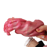 Masturbatore Jagged Bones rosa in silicone liquido con finitura iridescente e logo Magmara