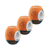 Uova masturbatorie Satisfyer Crunchy arancioni con design geometrico interno e logo stilizzato