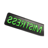 Paddle BDSM nero con scritta MISTRESS verde neon e bordi cuciti
