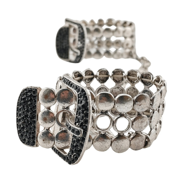 Dettaglio fibbia manette bondage Noir Argent Elegant Os con cristalli neri su metallo opaco