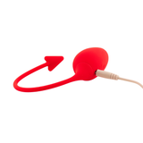 Ovetto vibrante rosso in silicone con cavo di ricarica beige inserito