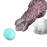 Ovipositor Pandora organico rosso-marrone con uovo turchese e pezzo grigio