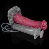 Dildo rosa in silicone con testa biforcuta e base grigia, accessorio per adulti con pompa