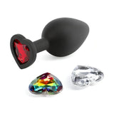 Plug anale nero in silicone con gemma cuore rossa intercambiabile e due opzioni extra