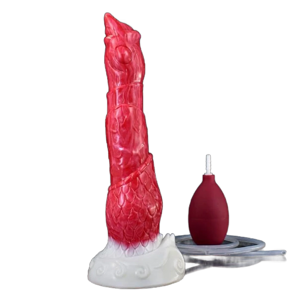 Vista frontale dildo silicone rosso texture scaglie occhio e bocca stilizzata