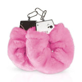 Manette in peluche rosa con fermagli metallici