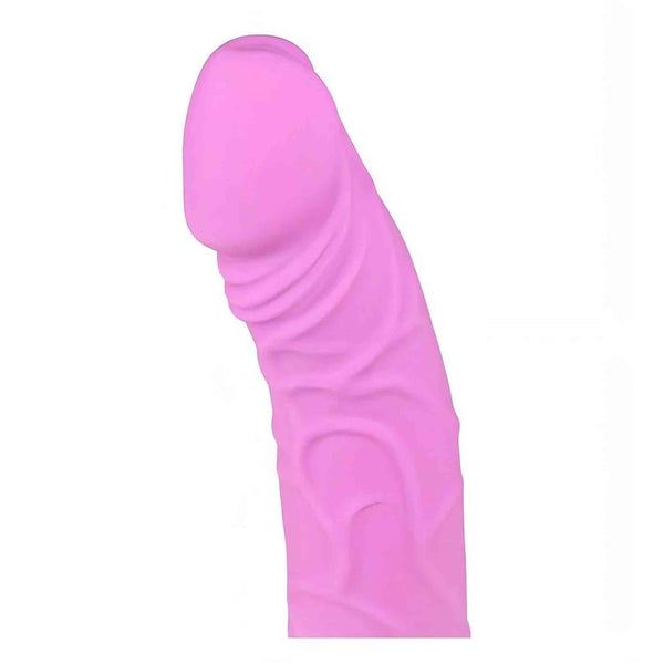 Primo piano testa glande vibratore rosa in silicone con texture