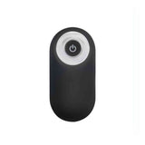 Telecomando wireless ovale nero per stimolatore prostatico con anello bianco e pulsante accensione