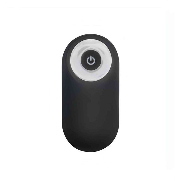 Telecomando wireless ovale nero per stimolatore prostatico con anello bianco e pulsante accensione