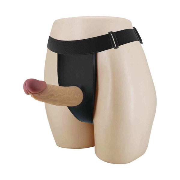 Strapon nero vuoto indossato lateralmente su manichino con pene in silicone