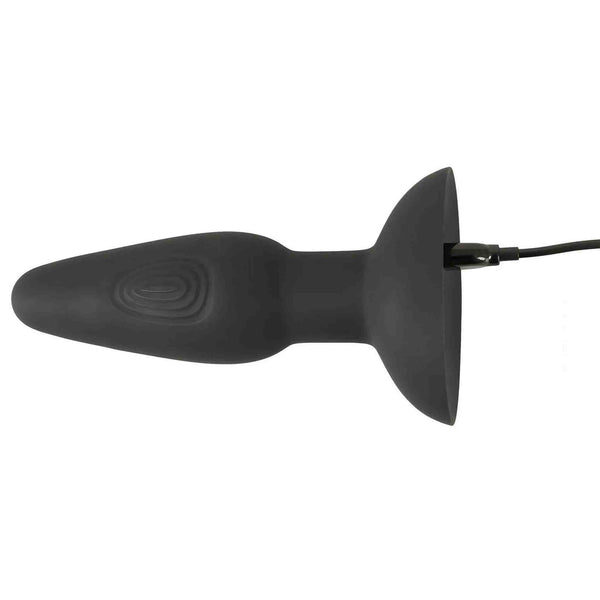 Plug anale nero in silicone con cavo di ricarica collegato e motivo a spirale laterale