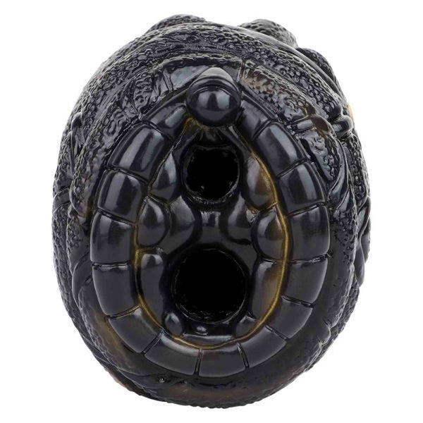 Vibratore per uomini in silicone liquido nero con dettagli giallo-oro e texture pelle di rettile
