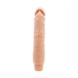 Dildo vibrante Soft Skin rosa carne vista frontale con base piatta a righe verticali