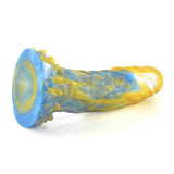 Dildo fantasy orizzontale blu giallo marbled con base dentellata