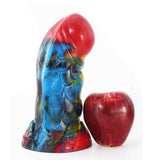 Statua dildo fantasy multicolore testa rossa texture scaglie drago con riferimento dimensioni mela