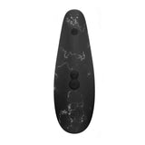 Stimolatore clitorideo Womanizer nero marmo bianco vista frontale dettagli