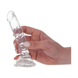 Mano femminile che tiene dong trasparente Real Rapture Small con superficie ondulata