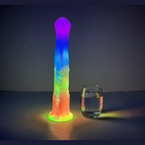 Dildo in silicone colorato che brilla al buio con base larga