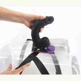 Strap-on nero montato su manichino trasparente